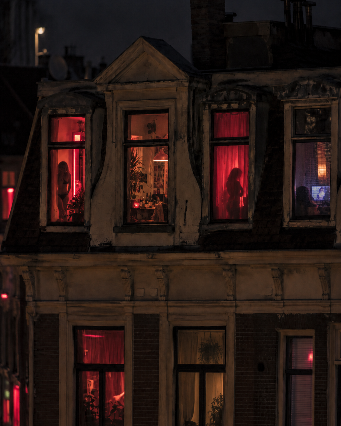 Apartment windows glowing at dusk, each frame hinting at a different private life